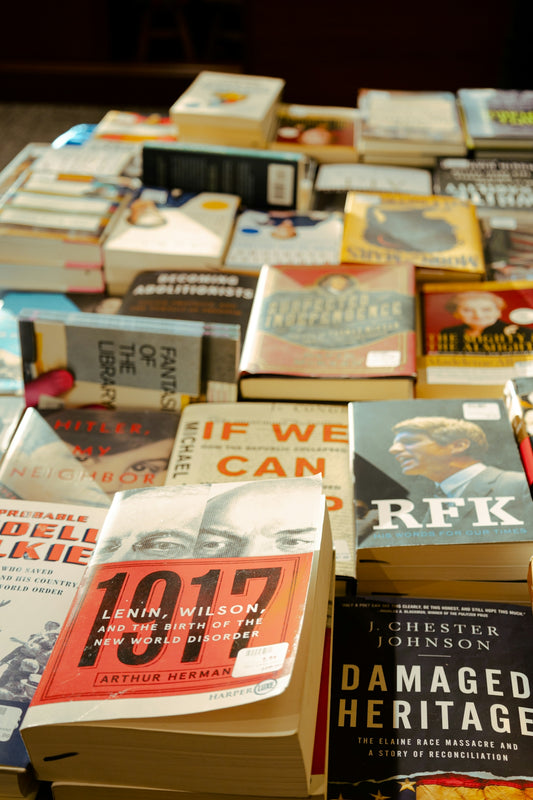 a pile of books sitting on top of a table
