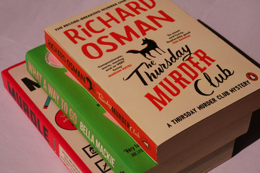 Three books stacked on top of each other